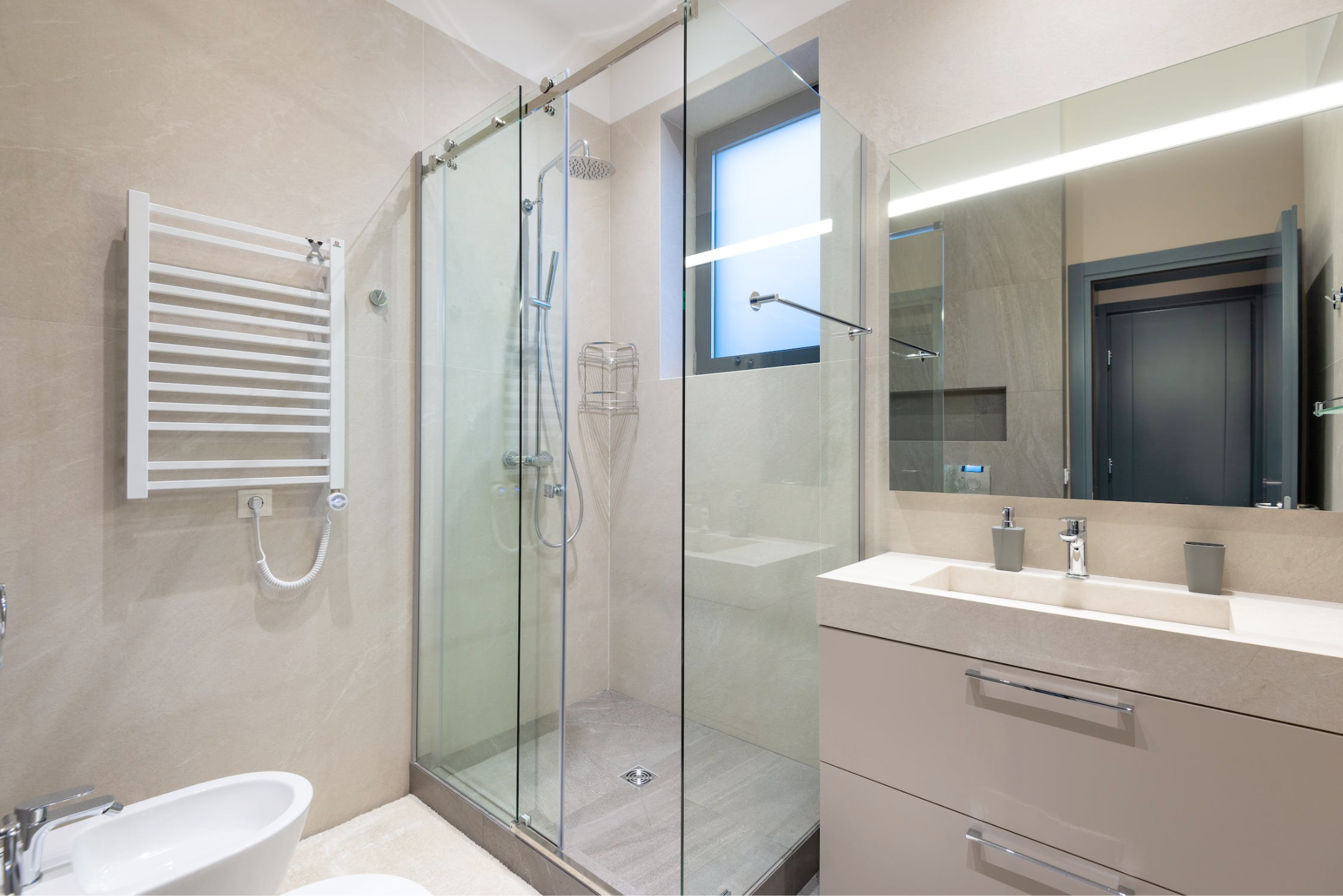 An image of a modern bathroom with sliding shower doors 
