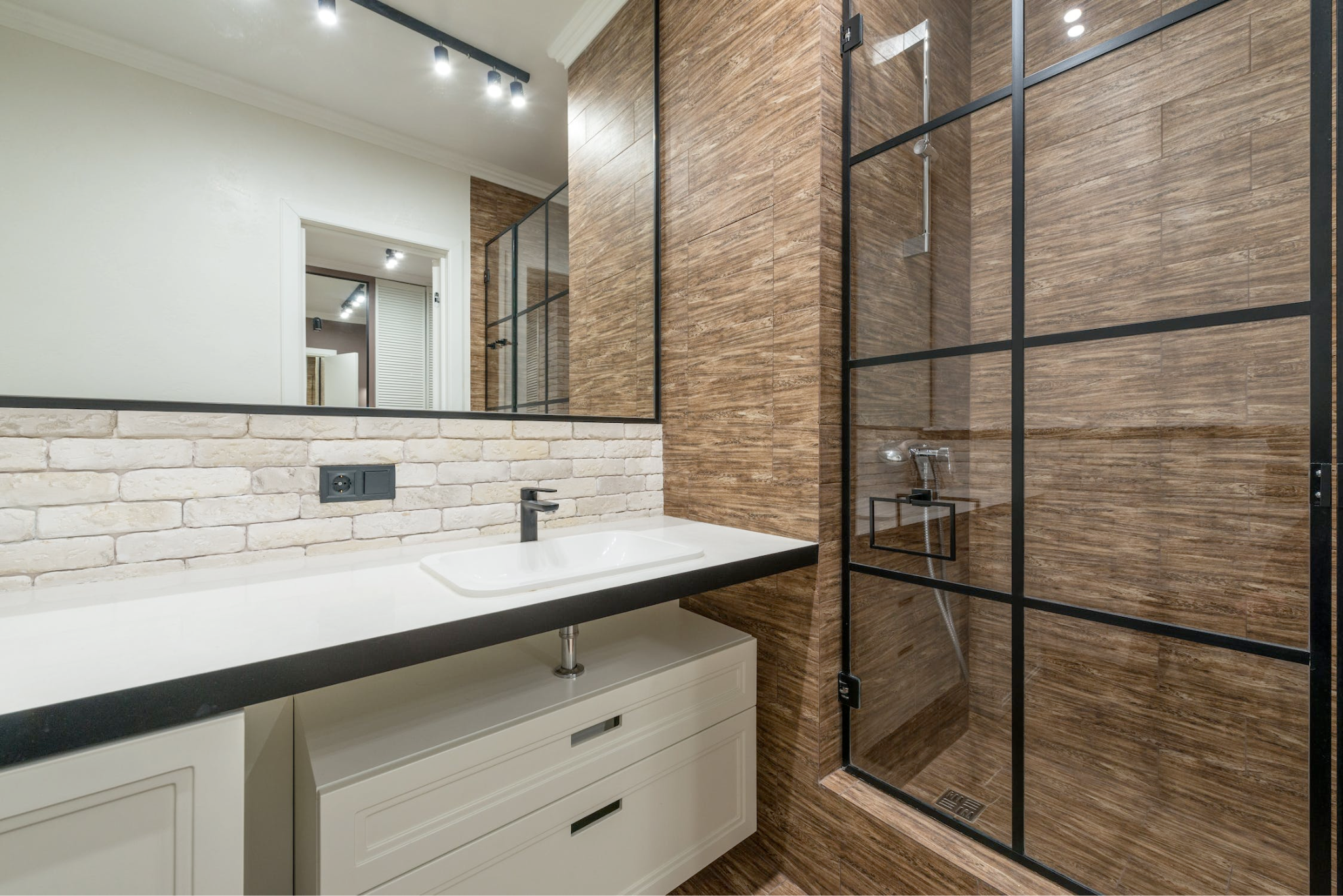 An image of a modern bathroom with sliding shower doors