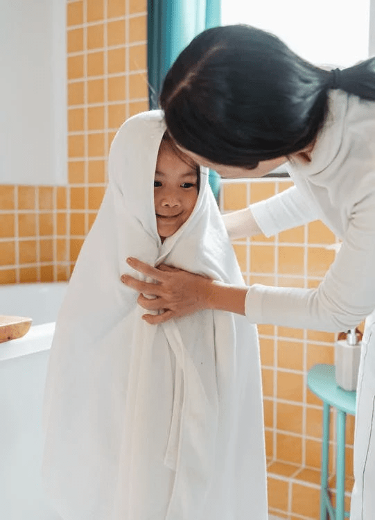 a kid in white towel