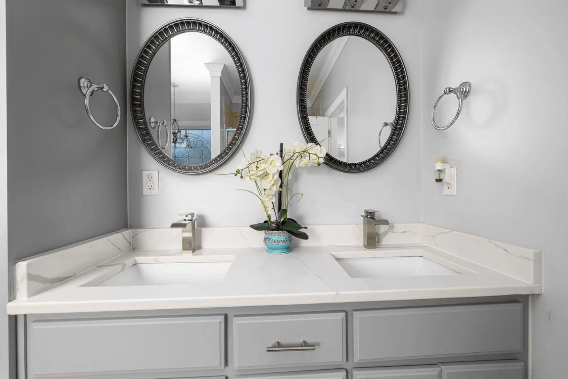 Two frameless mirrors in the bathroom