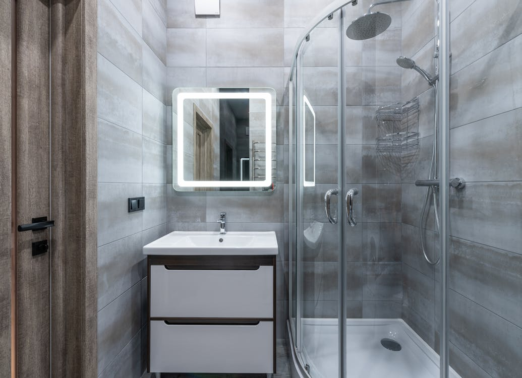 Modern bathroom interior with shower door 