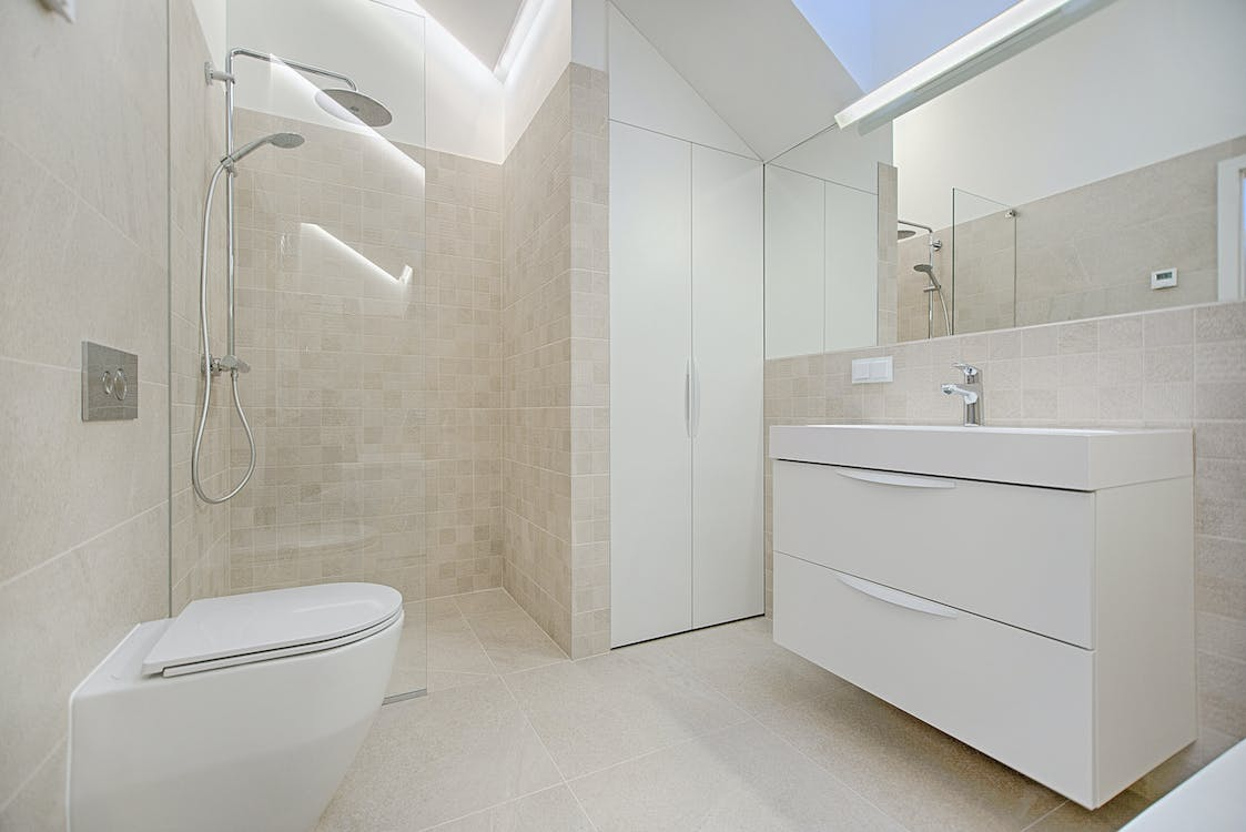 A bathroom with a neutral-colored interior