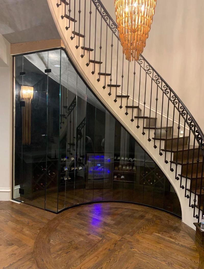 Custom Curved Glass Wine Room Under Staircase in Dallas, TX